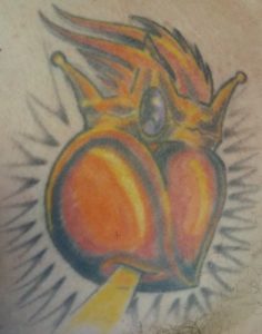 sacred heart with a crown tattoo / Big Tommy Tattoo