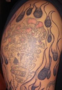 Joker Holding Cards and Chain Tattoo