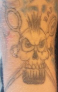 Skull with Scissors and Comb tattoo
