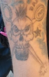 Skull with Scissors and Comb tattoo