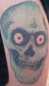 Powell Ripper Skull tattoo