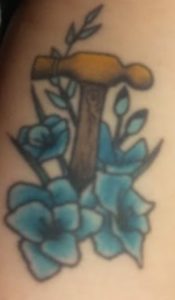Gladiolus flower and ball peen hammer tattoo