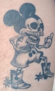 Skeleton Mickey Mouse giving the bird