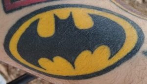 Batman emblem tattoo