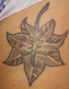 Maple leaf with goat Chinese zodiac tattoo