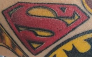 Sperman emblem tattoo