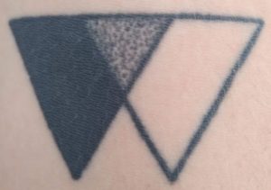 Stippling triangle tattoo