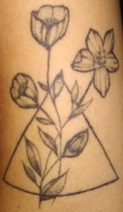 Triangle and flowers tattoo