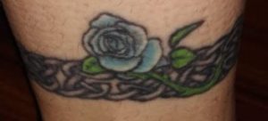 Celtic band with blue rose tattoo