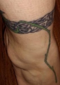 Celtic band with blue rose tattoo