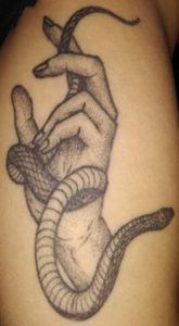 Hand with snake tattoo